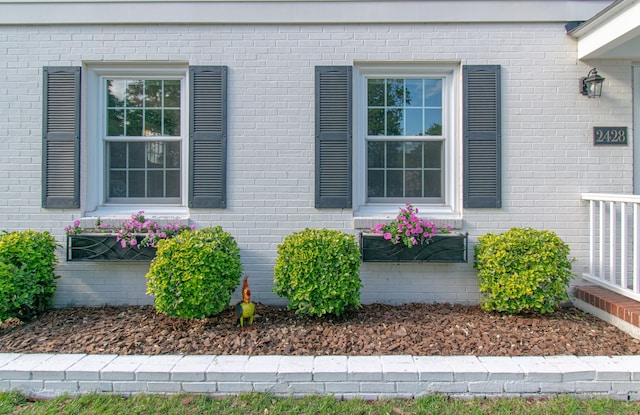 property entrance with brick siding