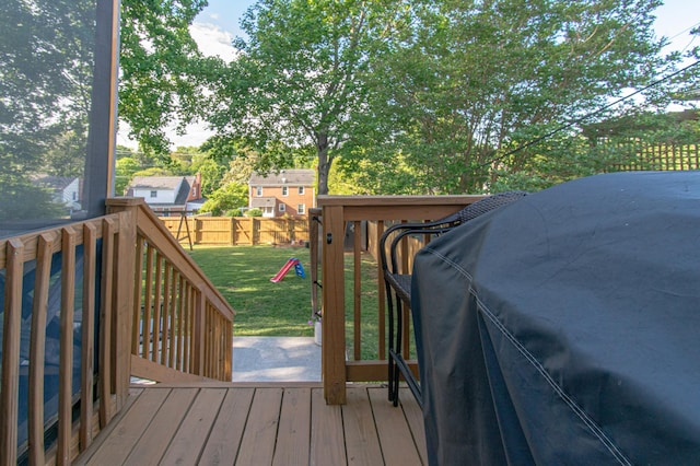 wooden terrace with a playground