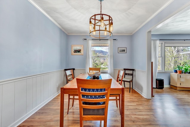 3553 Kidder Ln, Salem, VA 24153 - dining space with light wood-style floors, a chandelier, ornamental molding, and wainscoting