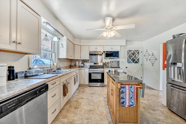 3553 Kidder Ln, Salem, VA 24153 - kitchen with appliances with stainless steel finishes, a sink, under cabinet range hood, and ceiling fan