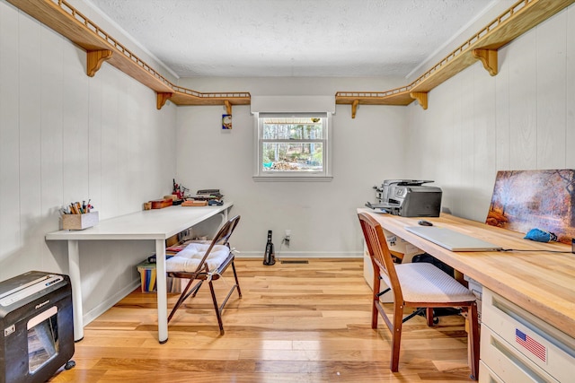 3553 Kidder Ln, Salem, VA 24153 - home office with a textured ceiling, light wood-style flooring, and wood walls