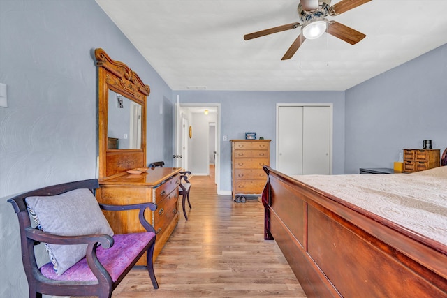 3553 Kidder Ln, Salem, VA 24153 - bedroom with light wood finished floors, a closet, ceiling fan, and baseboards