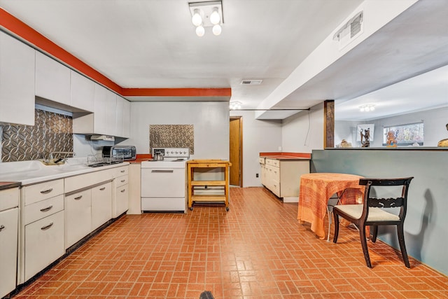 3553 Kidder Ln, Salem, VA 24153 - kitchen featuring white electric range oven, brick patterned floors, white cabinets, backsplash, and light countertops
