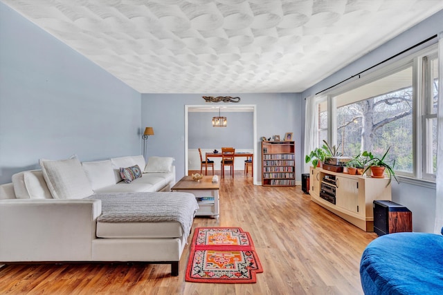 3553 Kidder Ln, Salem, VA 24153 - living area with plenty of natural light, light wood-style flooring, and a chandelier