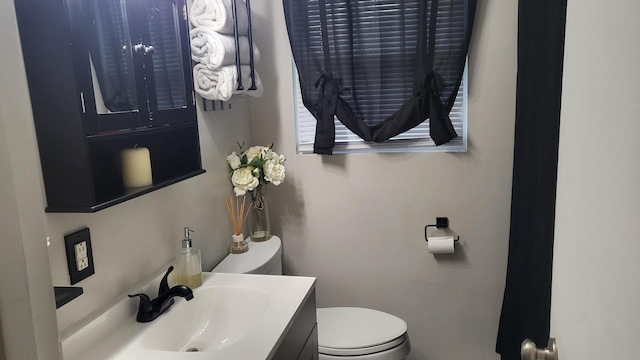 half bath with toilet and vanity