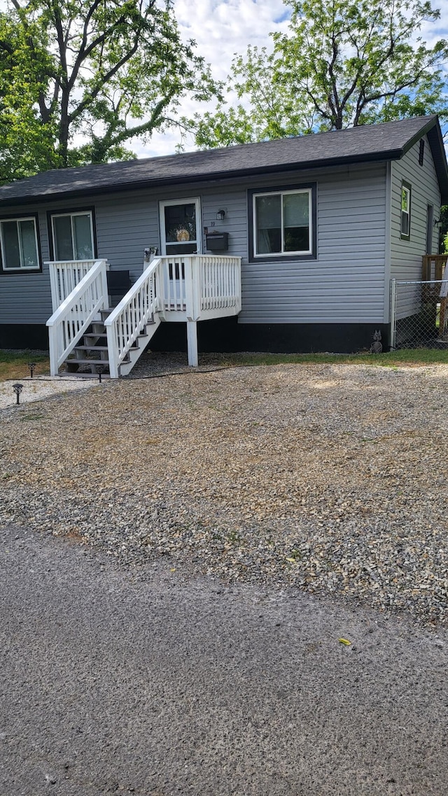 view of front facade featuring a wooden deck
