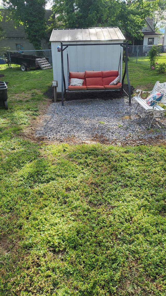 view of yard featuring a shed and an outdoor structure