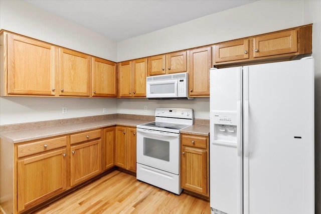 6618 Hartman Ct, Roanoke, VA 24019 - kitchen featuring white appliances, light wood-type flooring, and light countertops