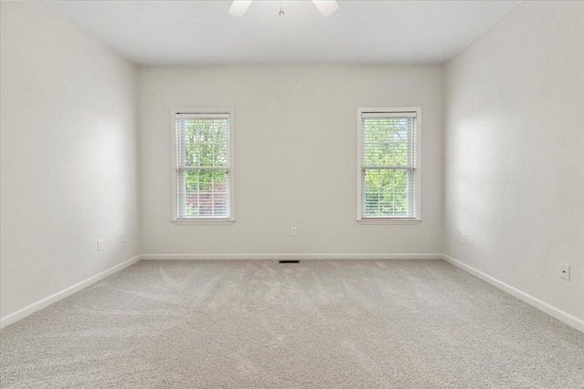 6618 Hartman Ct, Roanoke, VA 24019 - unfurnished room featuring plenty of natural light, carpet, baseboards, and ceiling fan