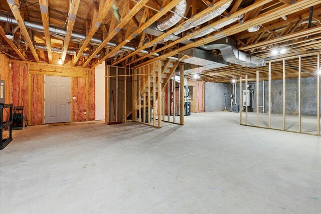 6618 Hartman Ct, Roanoke, VA 24019 - unfinished basement with gas water heater and a wood stove