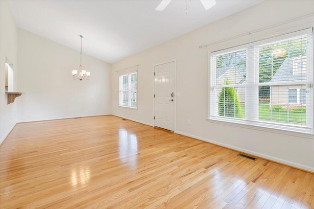 6618 Hartman Ct, Roanoke, VA 24019 - entryway featuring lofted ceiling, light wood-style floors, a chandelier, baseboards, and a ceiling fan