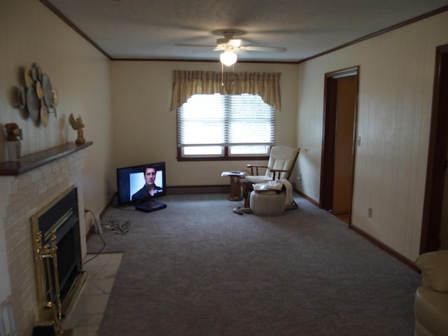 107 Lilac Dr, Shawsville, VA 24162 - sitting room featuring ornamental molding, a fireplace with flush hearth, carpet, a ceiling fan, and baseboards