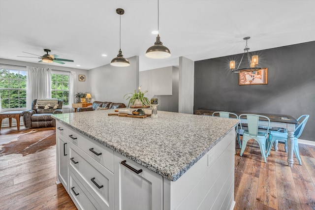 60 Surber Dr, Moneta, VA 24121 - kitchen featuring dark wood-style floors, open floor plan, white cabinetry, a ceiling fan, and pendant lighting