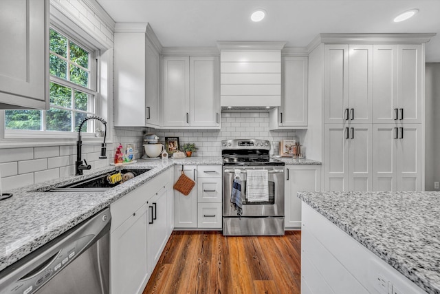 60 Surber Dr, Moneta, VA 24121 - kitchen featuring appliances with stainless steel finishes, white cabinets, a sink, decorative backsplash, and dark wood-style floors