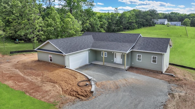 81 Belvior Cir, Moneta, VA 24121 - ranch-style house featuring asphalt driveway, a garage, roof with shingles, a front yard, and covered porch