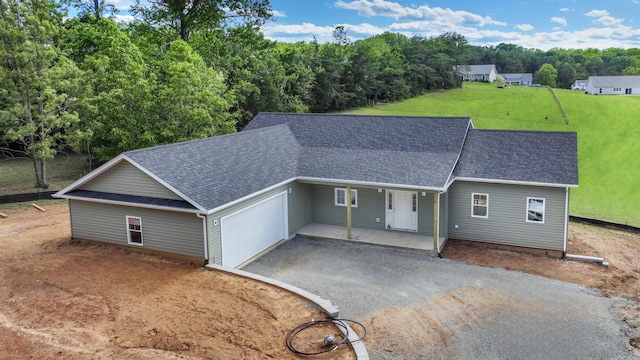 81 Belvior Cir, Moneta, VA 24121 - ranch-style home with asphalt driveway, roof with shingles, a front lawn, an attached garage, and a porch