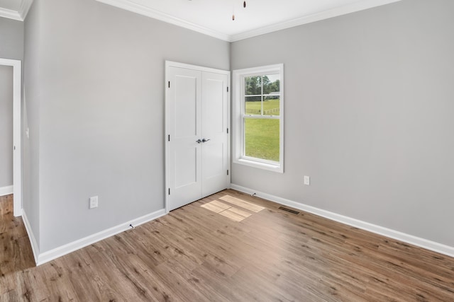 105 Belvior Cir, Moneta, VA 24121 - unfurnished bedroom with ornamental molding, wood finished floors, and a closet