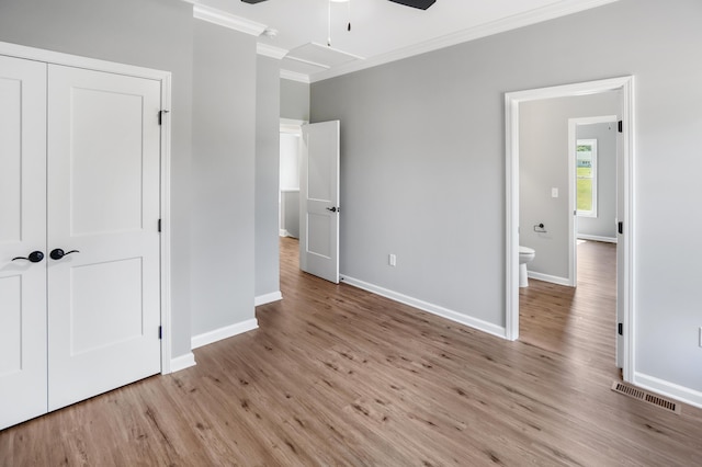 105 Belvior Cir, Moneta, VA 24121 - unfurnished bedroom with crown molding, wood finished floors, a closet, and ceiling fan