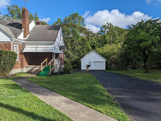 1987 Franklin St, Rocky Mount, VA 24151 - view of home's exterior with an outbuilding, a garage, brick siding, driveway, and a yard