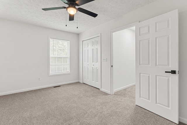 1503 Cassell Ln, Bedford, VA 24523 - unfurnished bedroom featuring carpet flooring, a textured ceiling, baseboards, a closet, and ceiling fan