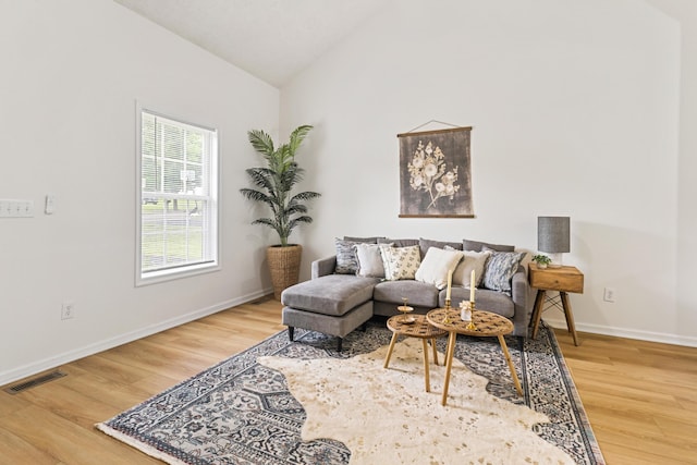 1503 Cassell Ln, Bedford, VA 24523 - living room with lofted ceiling, wood finished floors, and baseboards