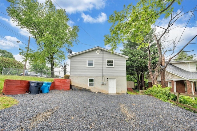 view of side of property featuring fence