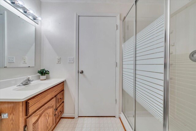 112 N Rome Dr, Roanoke, VA 24019 - bathroom with vanity, a stall shower, and baseboards