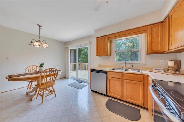 112 N Rome Dr, Roanoke, VA 24019 - kitchen with stainless steel appliances, a sink, light countertops, and decorative light fixtures