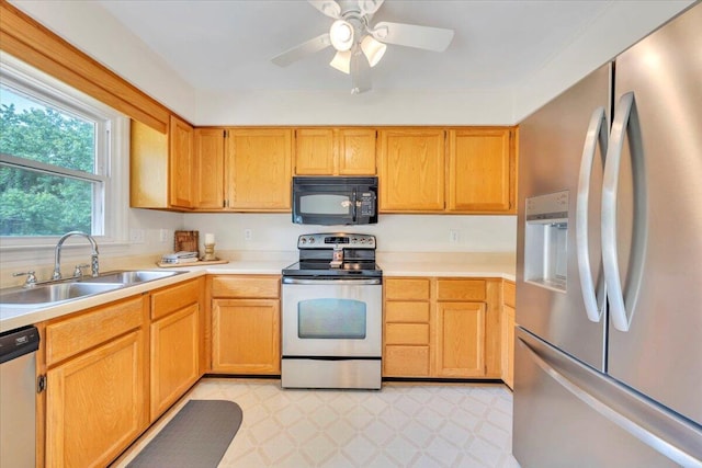 112 N Rome Dr, Roanoke, VA 24019 - kitchen with stainless steel appliances, a sink, light countertops, ceiling fan, and light floors
