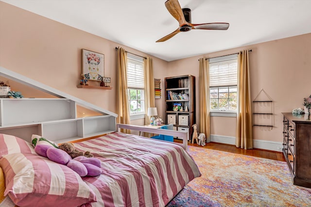 2408 Avenham Ave SW, Roanoke, VA 24014 - bedroom with multiple windows, wood finished floors, baseboards, and ceiling fan