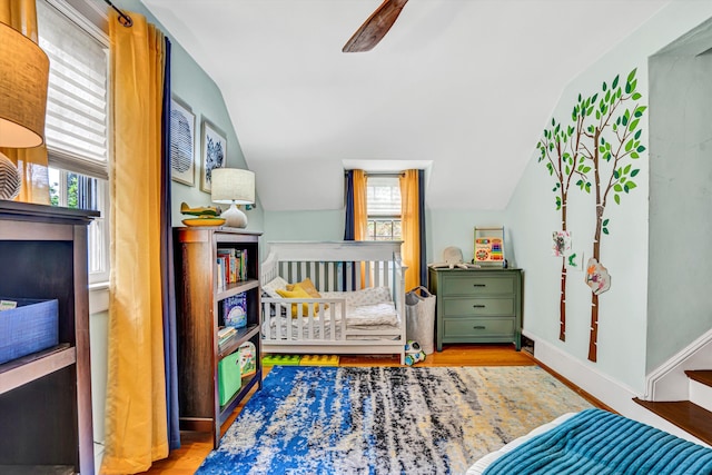 2408 Avenham Ave SW, Roanoke, VA 24014 - bedroom with multiple windows, vaulted ceiling, wood finished floors, and baseboards