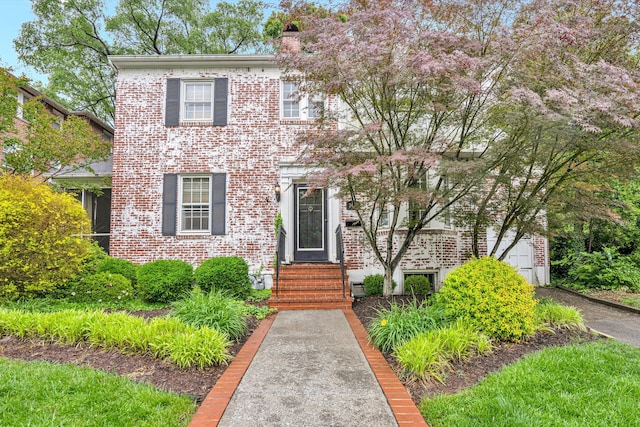 2408 Avenham Ave SW, Roanoke, VA 24014 - view of front of home featuring entry steps, brick siding, and a chimney