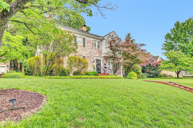 2408 Avenham Ave SW, Roanoke, VA 24014 - colonial inspired home with a chimney, a front yard, and brick siding