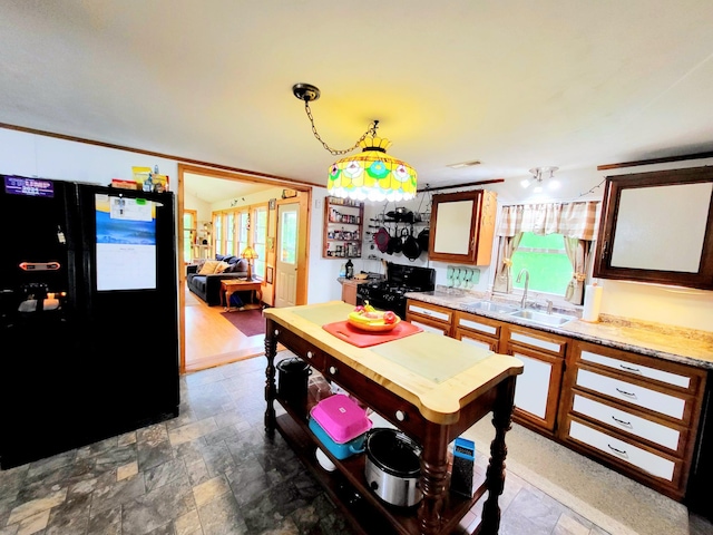 1652 Happy Acres Dr, Moneta, VA 24121 - kitchen with black appliances, a sink, light countertops, and stone finish flooring