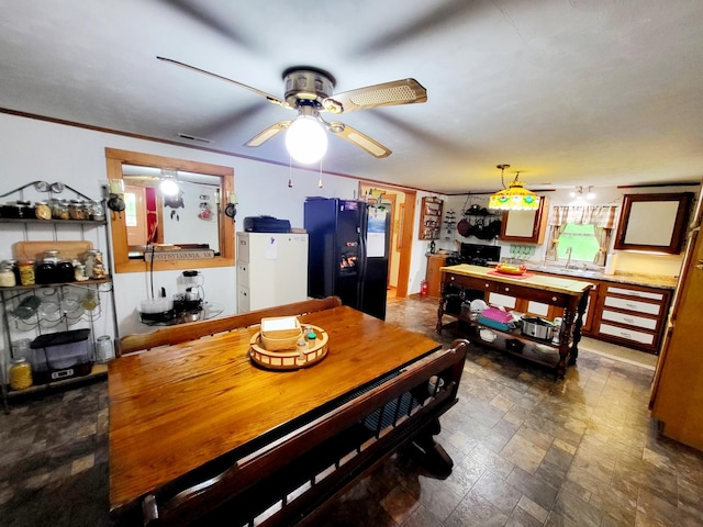 1652 Happy Acres Dr, Moneta, VA 24121 - dining room featuring a ceiling fan and dark stone finish flooring