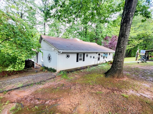 1652 Happy Acres Dr, Moneta, VA 24121 - view of side of home with roof with shingles and stucco siding