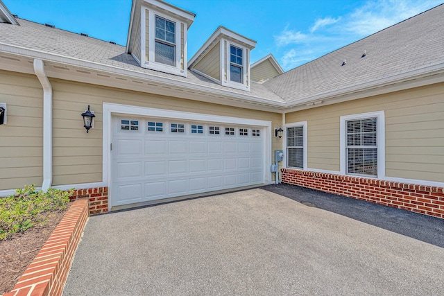 115 Professional Dr, Hardy, VA 24101 - view of exterior entry with brick siding, asphalt driveway, and a garage