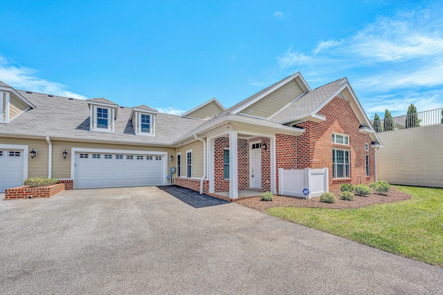115 Professional Dr, Hardy, VA 24101 - view of front of house featuring asphalt driveway, brick siding, an attached garage, and roof with shingles