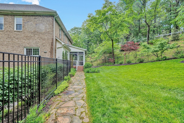 view of yard featuring a sunroom