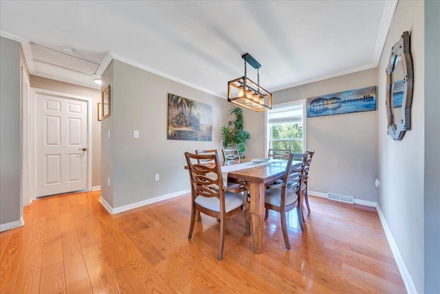 414 Mallard Cove Rd, Moneta, VA 24121 - dining area featuring light wood finished floors, crown molding, baseboards, and attic access
