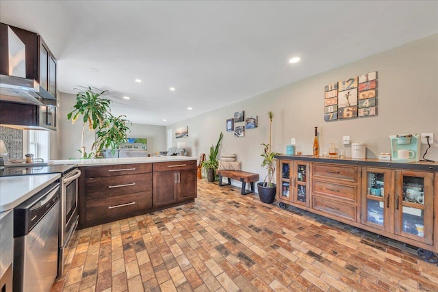 414 Mallard Cove Rd, Moneta, VA 24121 - kitchen featuring wall chimney exhaust hood, range, stainless steel dishwasher, brick patterned flooring, and a peninsula