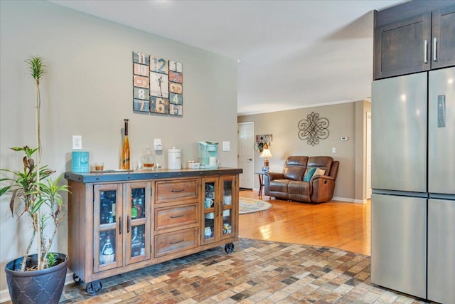 414 Mallard Cove Rd, Moneta, VA 24121 - bar area with stainless steel fridge and brick patterned flooring