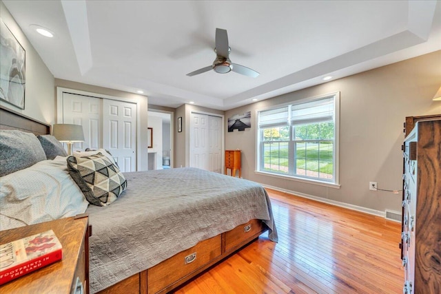 414 Mallard Cove Rd, Moneta, VA 24121 - bedroom with two closets, baseboards, light wood-style floors, recessed lighting, and ceiling fan