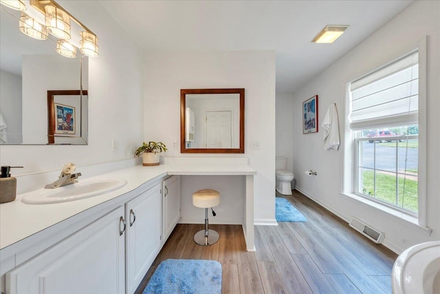 414 Mallard Cove Rd, Moneta, VA 24121 - bathroom featuring toilet, wood finished floors, vanity, and baseboards