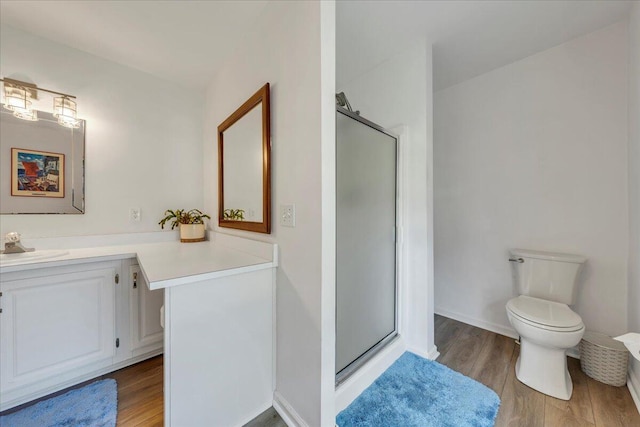 414 Mallard Cove Rd, Moneta, VA 24121 - full bath featuring a stall shower, vanity, wood finished floors, and toilet