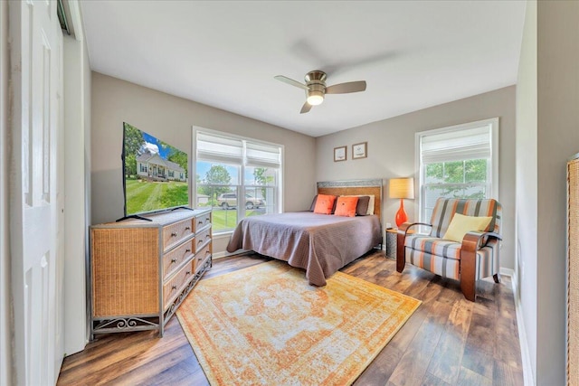 414 Mallard Cove Rd, Moneta, VA 24121 - bedroom with multiple windows, wood finished floors, and a ceiling fan