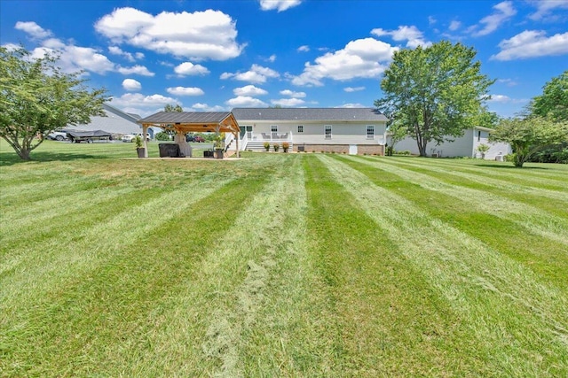 414 Mallard Cove Rd, Moneta, VA 24121 - back of house featuring a gazebo, a lawn, a wooden deck, and a carport