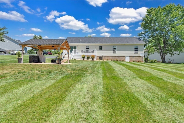 414 Mallard Cove Rd, Moneta, VA 24121 - rear view of house featuring a gazebo, a deck, and a yard