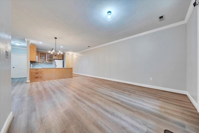 2521 Feather Garden Cir, Vinton, VA 24179 - unfurnished living room with ornamental molding, a chandelier, baseboards, light wood-style flooring, and recessed lighting
