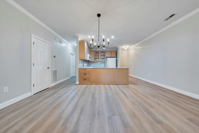 2521 Feather Garden Cir, Vinton, VA 24179 - kitchen with white appliances, a chandelier, baseboards, ornamental molding, and light wood-style flooring